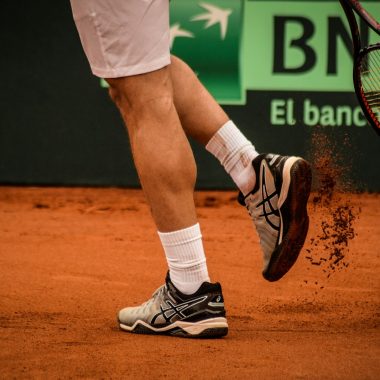 a tennis player with a tennis racket in his hand