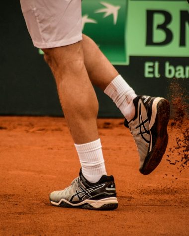 a tennis player with a tennis racket in his hand