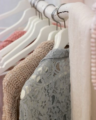 clothes hanging on white rack