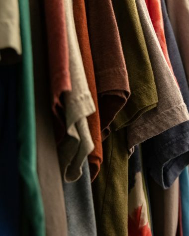 assorted clothes hanged on rack