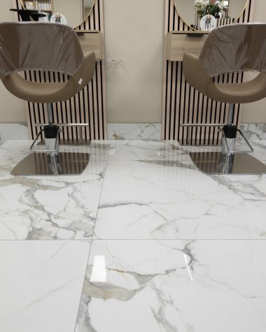 a pair of chairs sitting on top of a marble floor