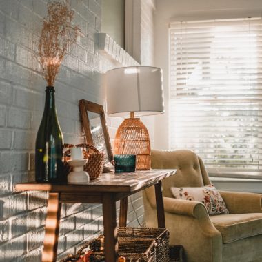 a living room with a chair and a table